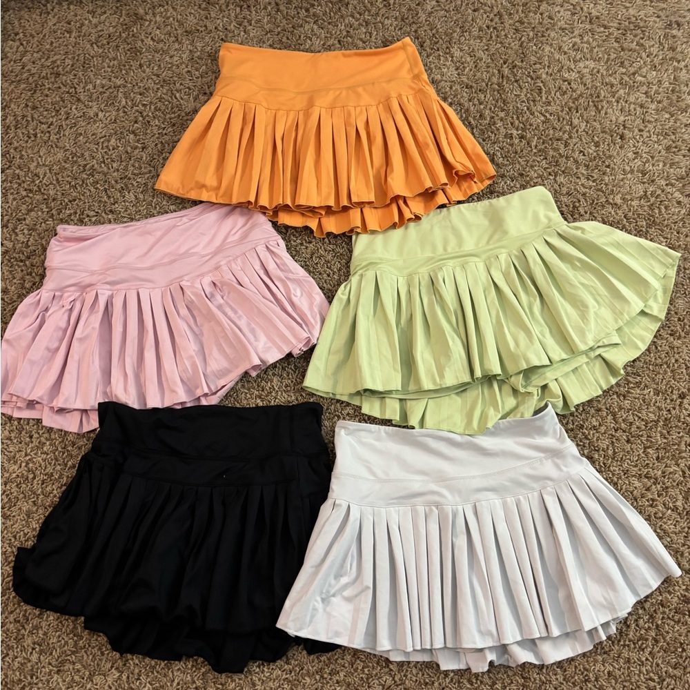Pleated Skirt green,pink,orange,black,and white EACH $15
